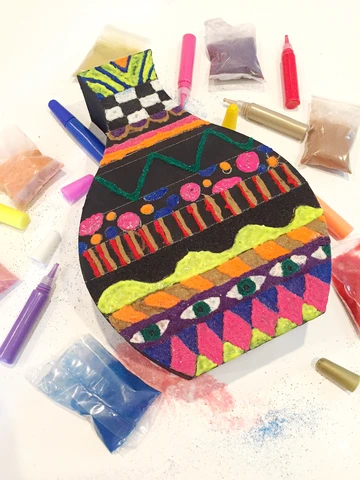 Use colored sand to create a beautiful boho chic vase!
